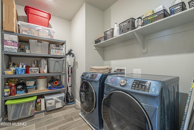 1117 W Valley Meadow Ln, Sahuarita, AZ 85629 - laundry room with washer and dryer, wood tiled floors, and baseboards
