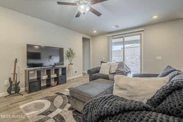1117 W Valley Meadow Ln, Sahuarita, AZ 85629 - living room featuring baseboards, a ceiling fan, light wood-style floors, and recessed lighting