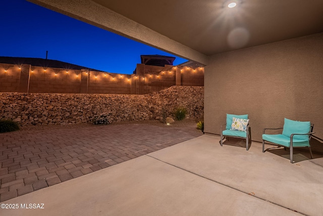 1117 W Valley Meadow Ln, Sahuarita, AZ 85629 - patio at twilight with a fenced backyard