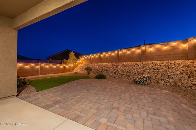 1117 W Valley Meadow Ln, Sahuarita, AZ 85629 - patio at twilight with a fenced backyard