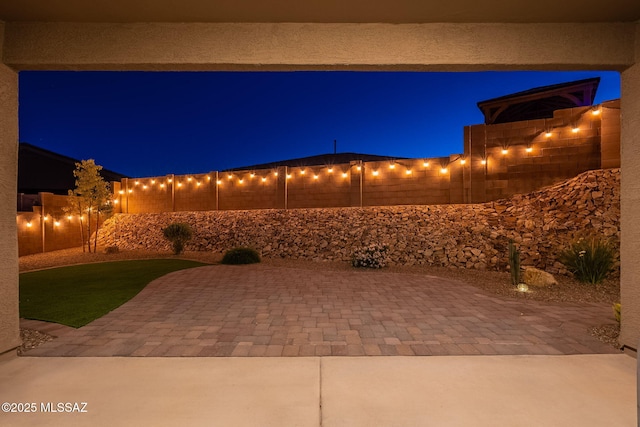 1117 W Valley Meadow Ln, Sahuarita, AZ 85629 - view of patio at night