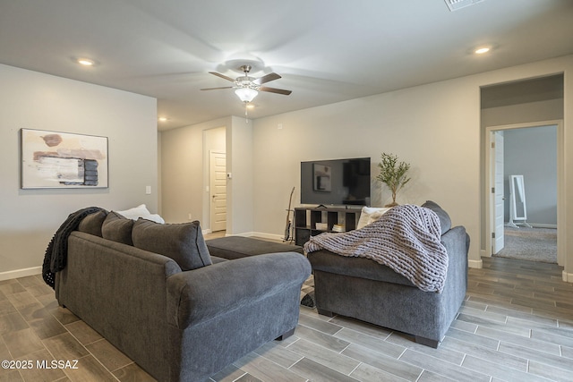 1117 W Valley Meadow Ln, Sahuarita, AZ 85629 - living room featuring wood tiled floors, baseboards, a ceiling fan, and recessed lighting