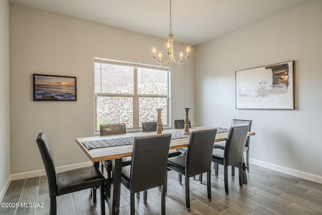 1117 W Valley Meadow Ln, Sahuarita, AZ 85629 - dining room featuring a chandelier, baseboards, and wood finished floors