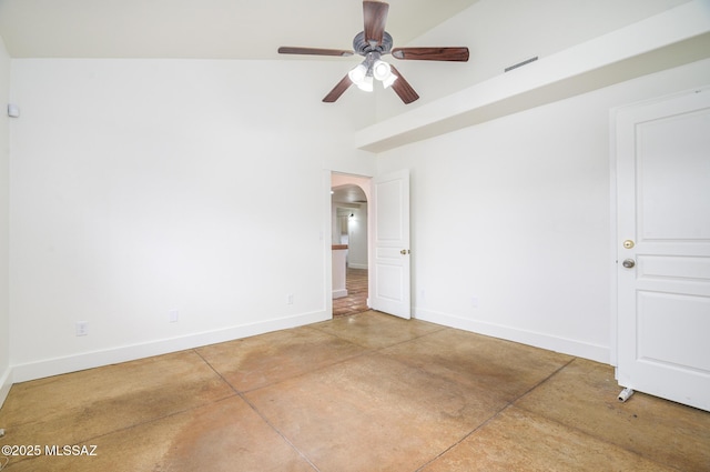 3737 E Pima St, Tucson, AZ 85716 - empty room with arched walkways, concrete flooring, ceiling fan, and baseboards