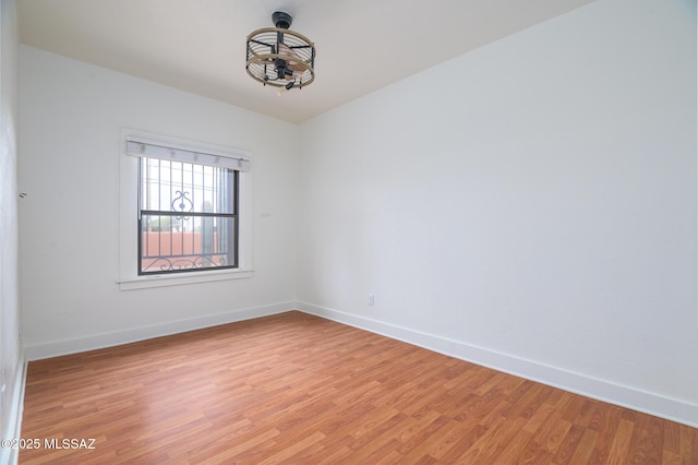 3737 E Pima St, Tucson, AZ 85716 - unfurnished room with baseboards and light wood-type flooring
