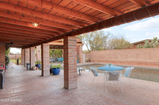 6341 E Brian Kent St, Tucson, AZ 85710 - view of patio / terrace with a fenced backyard and outdoor dining space