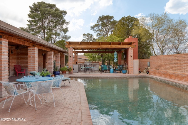 6341 E Brian Kent St, Tucson, AZ 85710 - view of pool with outdoor dining space, fence, a fenced in pool, and a patio