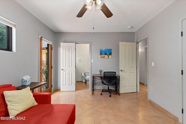 6341 E Brian Kent St, Tucson, AZ 85710 - home office featuring concrete flooring, baseboards, and a ceiling fan