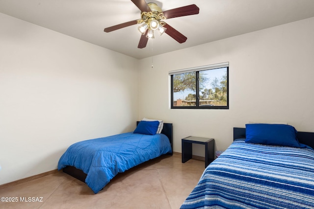 6341 E Brian Kent St, Tucson, AZ 85710 - bedroom featuring finished concrete flooring and ceiling fan