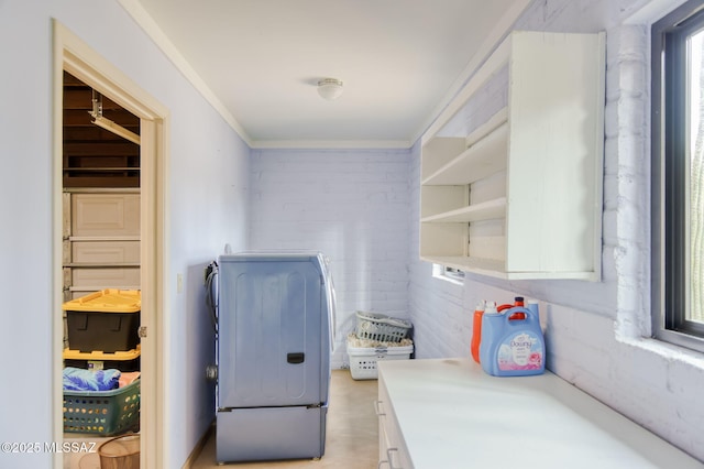 6341 E Brian Kent St, Tucson, AZ 85710 - kitchen featuring washer / clothes dryer, light countertops, crown molding, and open shelves