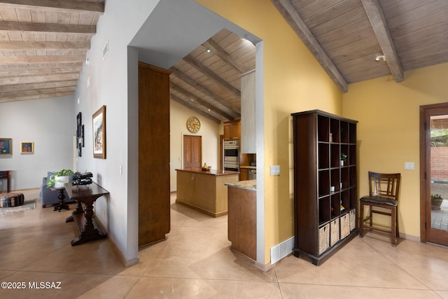 6341 E Brian Kent St, Tucson, AZ 85710 - hallway with beamed ceiling, baseboards, high vaulted ceiling, and wooden ceiling