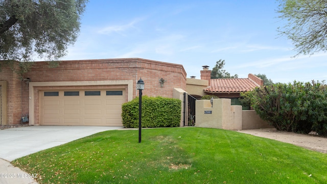view of front of house featuring a front yard, brick siding, an attached garage, a chimney, and driveway