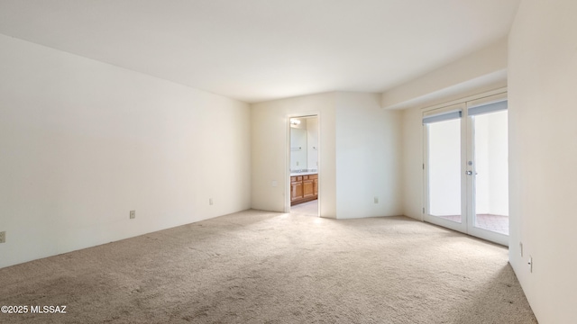 unfurnished living room featuring a high ceiling, carpet flooring, a ceiling fan, and visible vents