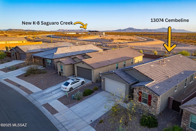 birds eye view of property with a mountain view