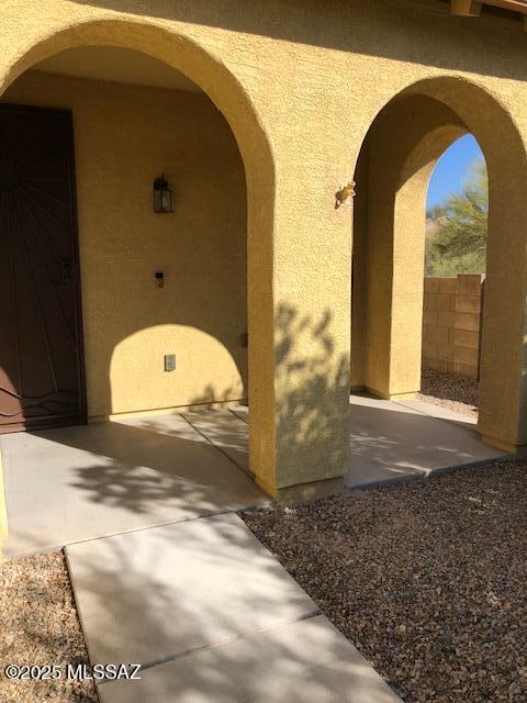 12171 N Golden Mirror Dr, Marana, AZ 85658 - property entrance featuring stucco siding and fence