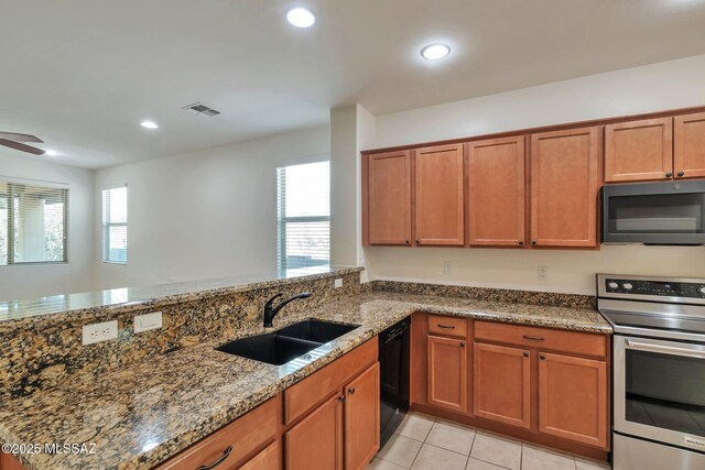unfurnished room with carpet floors, visible vents, and ceiling fan