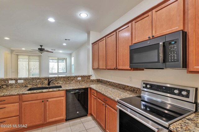 unfurnished room with light carpet, a ceiling fan, visible vents, and plenty of natural light