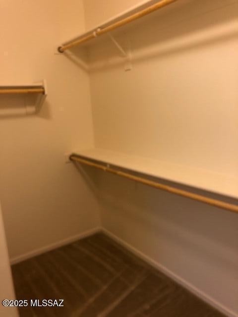 unfurnished room with baseboards, visible vents, and carpet