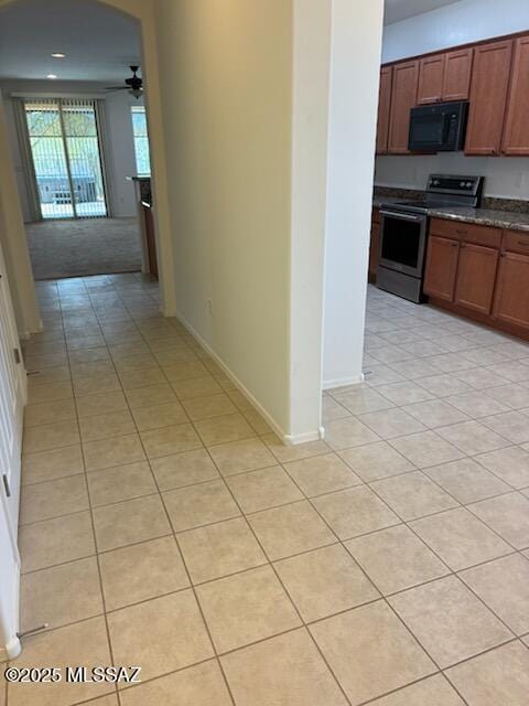 12171 N Golden Mirror Dr, Marana, AZ 85658 - hall with light tile patterned floors and baseboards