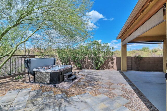 mediterranean / spanish-style home with an attached garage, a tile roof, concrete driveway, and stucco siding