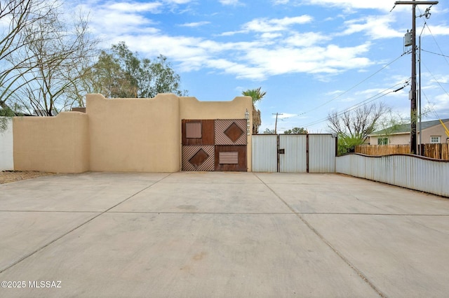 view of patio / terrace featuring fence and a gate