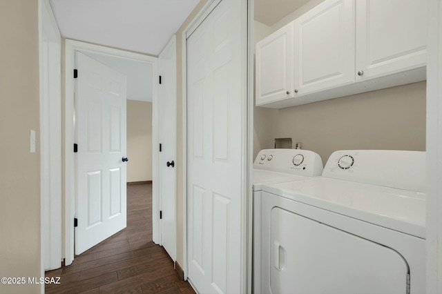 clothes washing area featuring cabinet space, independent washer and dryer, and dark wood-style floors