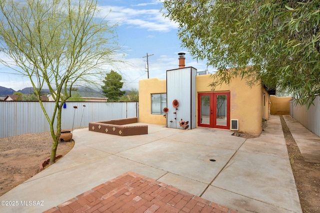 exterior space with a fenced backyard and a patio