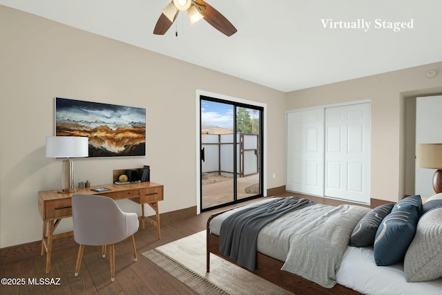bedroom with a closet, baseboards, ceiling fan, wood finished floors, and access to outside