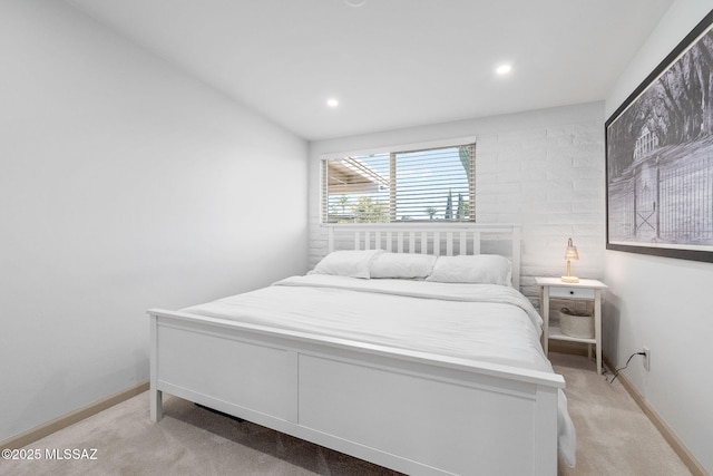 bedroom with recessed lighting, light colored carpet, and baseboards