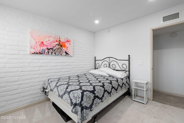 bedroom with visible vents, baseboards, brick wall, carpet, and recessed lighting