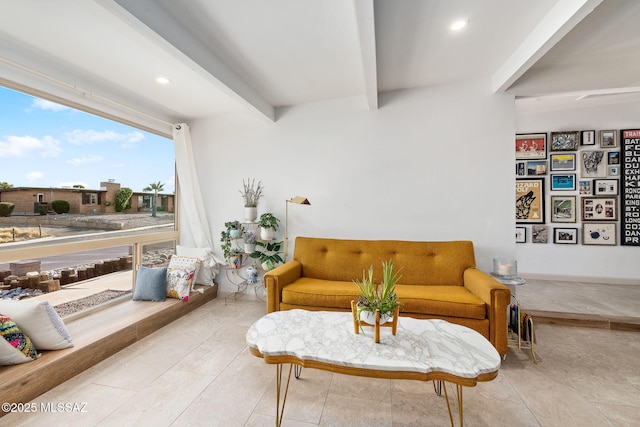 living area featuring beam ceiling and recessed lighting
