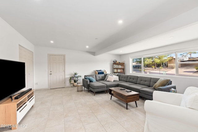living room with light tile patterned floors and recessed lighting
