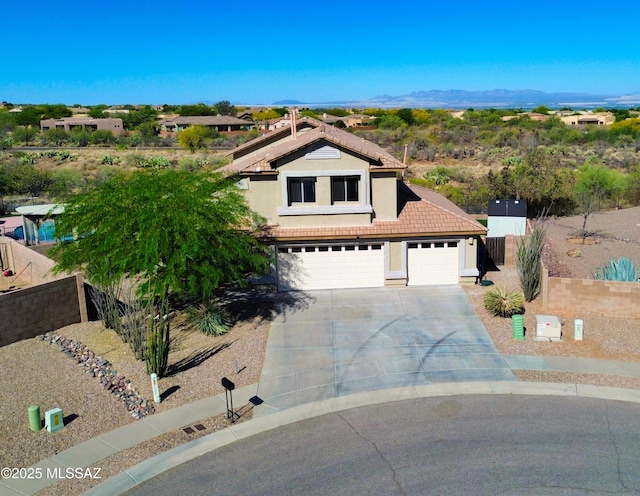 761 W Grantham St, Vail, AZ 85641 - view of front facade with fence, concrete driveway, a garage, stucco siding, and a tiled roof