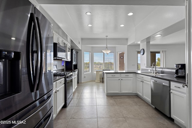 761 W Grantham St, Vail, AZ 85641 - kitchen with a wealth of natural light, dark countertops, stainless steel appliances, and a sink
