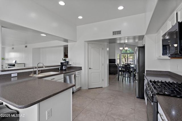 761 W Grantham St, Vail, AZ 85641 - kitchen with a sink, stainless steel appliances, dark countertops, and visible vents