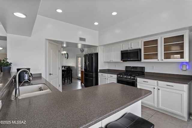 761 W Grantham St, Vail, AZ 85641 - kitchen with a sink, black fridge, dark countertops, visible vents, and gas stove
