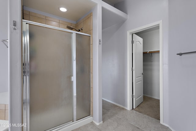 761 W Grantham St, Vail, AZ 85641 - full bath featuring a stall shower, a spacious closet, baseboards, and tile patterned floors