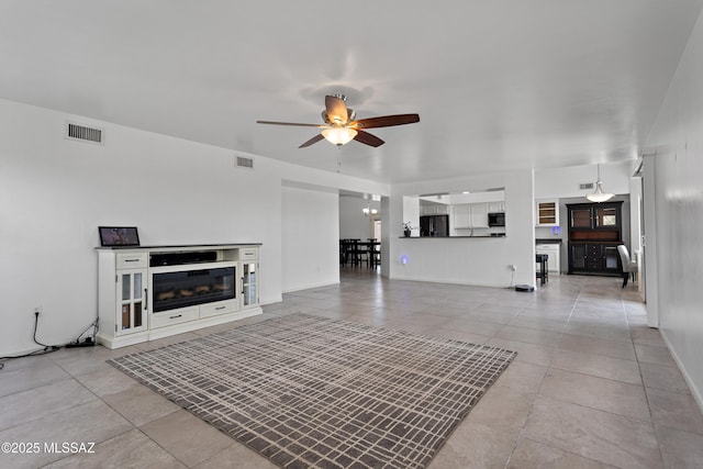 761 W Grantham St, Vail, AZ 85641 - unfurnished living room with ceiling fan, light tile patterned floors, and visible vents