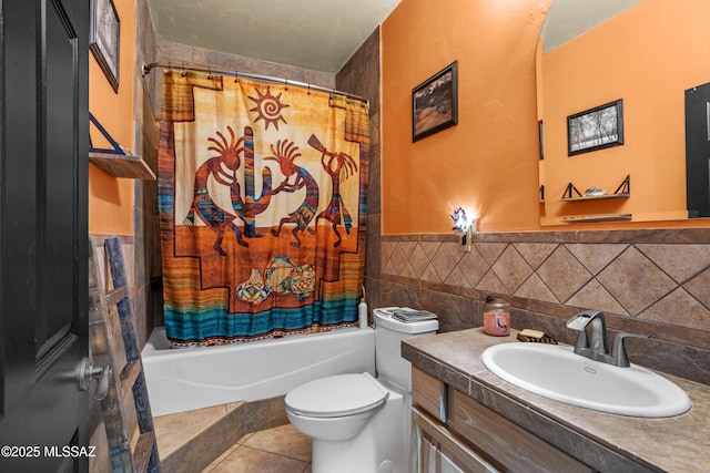 bathroom with vanity, shower / bath combo, tile patterned flooring, toilet, and tile walls