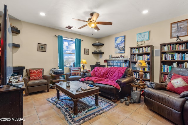 living room with light tile patterned flooring, a ceiling fan, visible vents, and recessed lighting