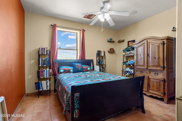 bedroom featuring light tile patterned flooring, baseboards, a ceiling fan, and visible vents