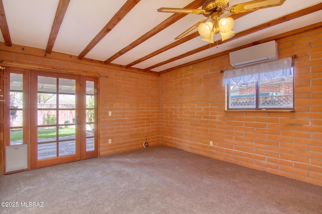 carpeted spare room featuring brick wall, an AC wall unit, a ceiling fan, and beam ceiling