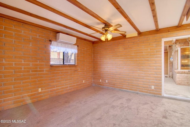 empty room featuring a wall mounted air conditioner, brick wall, a ceiling fan, beam ceiling, and carpet