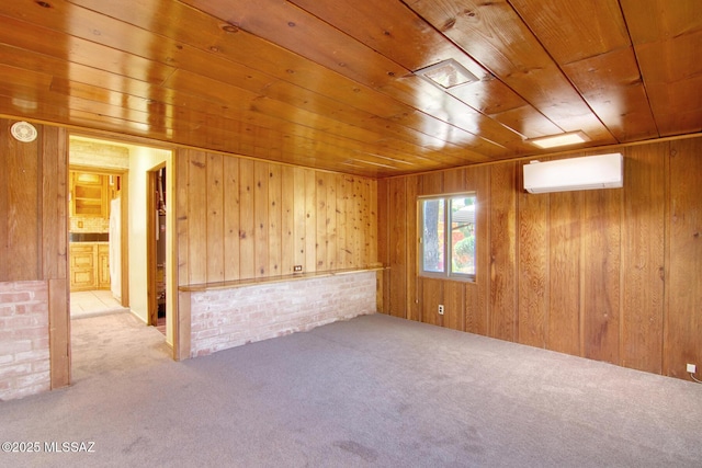 spare room with a wall mounted AC, wooden ceiling, wood walls, and carpet flooring