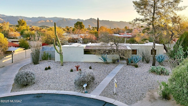 view of yard with a mountain view and fence