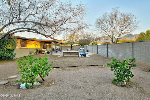 view of yard featuring outdoor lounge area, a fenced backyard, a fenced in pool, and a patio area