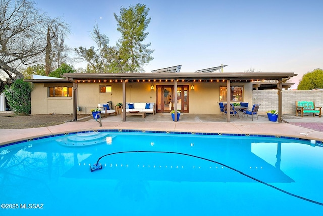 view of pool featuring a fenced in pool, a patio, french doors, and fence