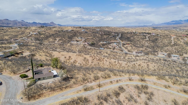 bird's eye view with a mountain view and view of desert