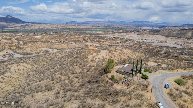 aerial view with a mountain view and view of desert