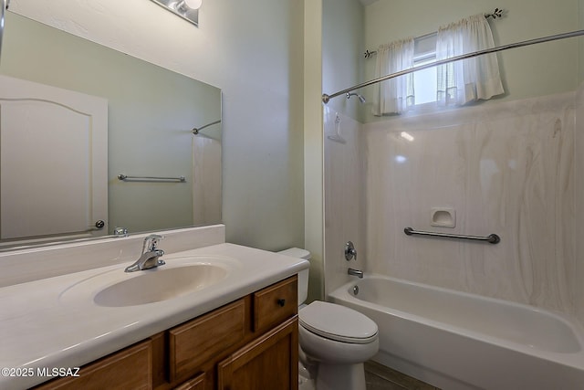 bathroom with vanity,  shower combination, and toilet